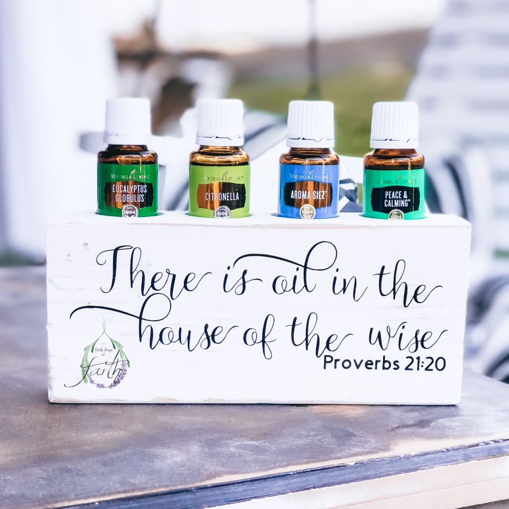 There is oil in the house of the wise. Proverbs 21:20 wood block holding 4 15 ml bottles of oil. June's Promos: Peace and Calming, Eucalyptus Globulous, Citronella, and Aroma Seiz